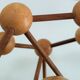 Sculptural modeling of a solid wood atom contemporary design