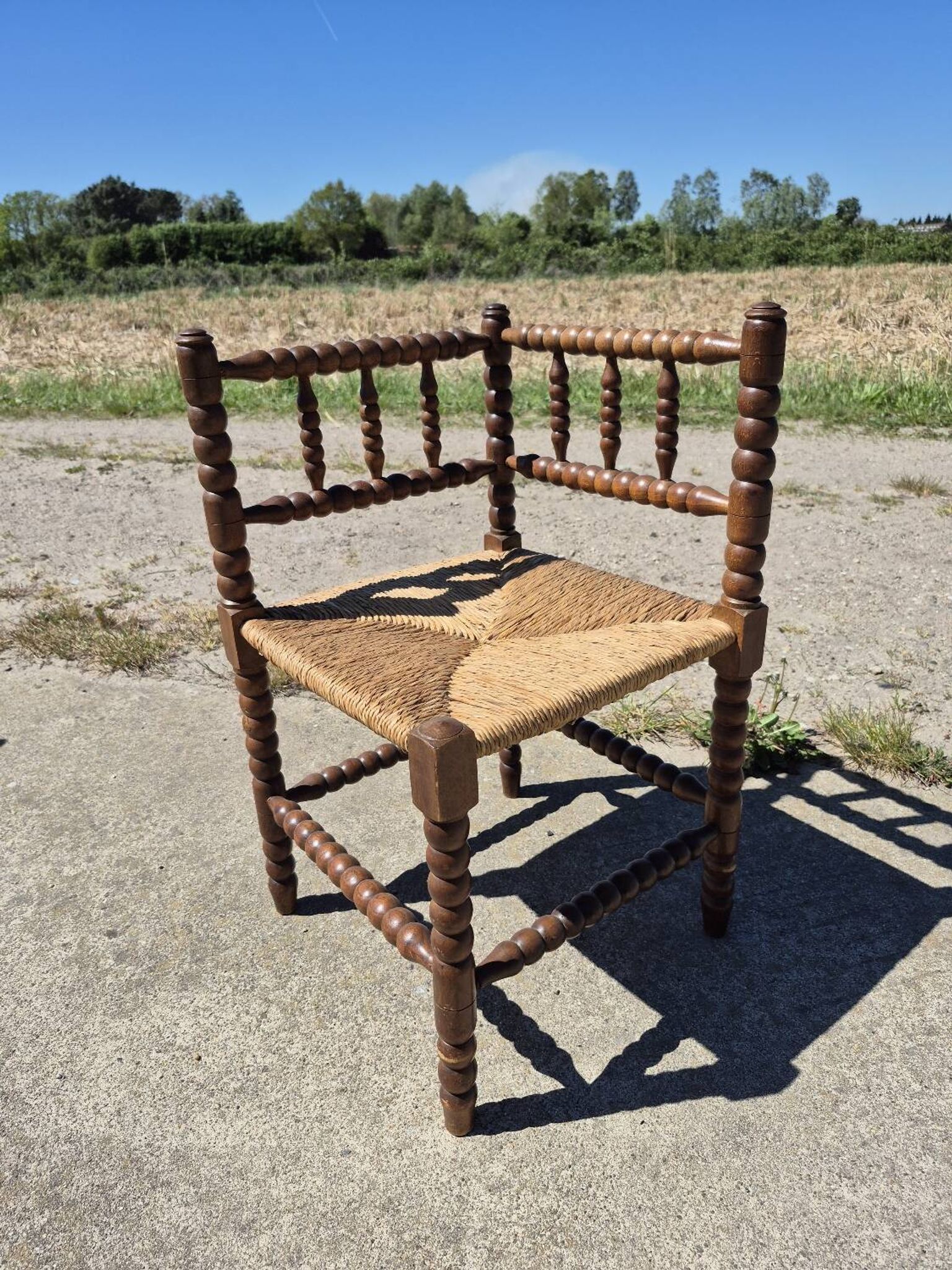 Vintage Dutch rustic corner chair bobbin turned oak with rush seating