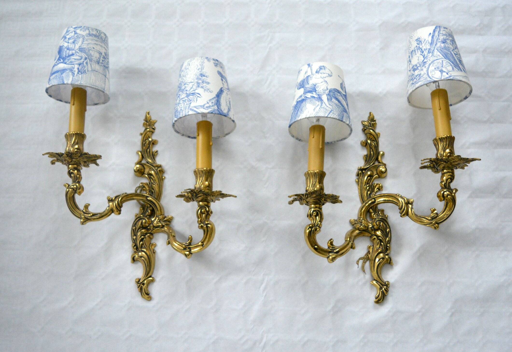 2 brass wall lights with toile de jouy lampshades