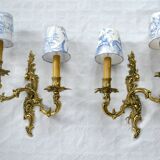 2 brass wall lights with toile de jouy lampshades