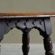 Rustic stool or side table in turned and carved solid oak, 19th century.