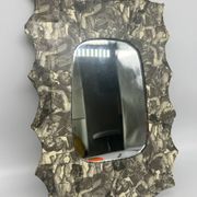 Free-form mirror decorated with cherubs.