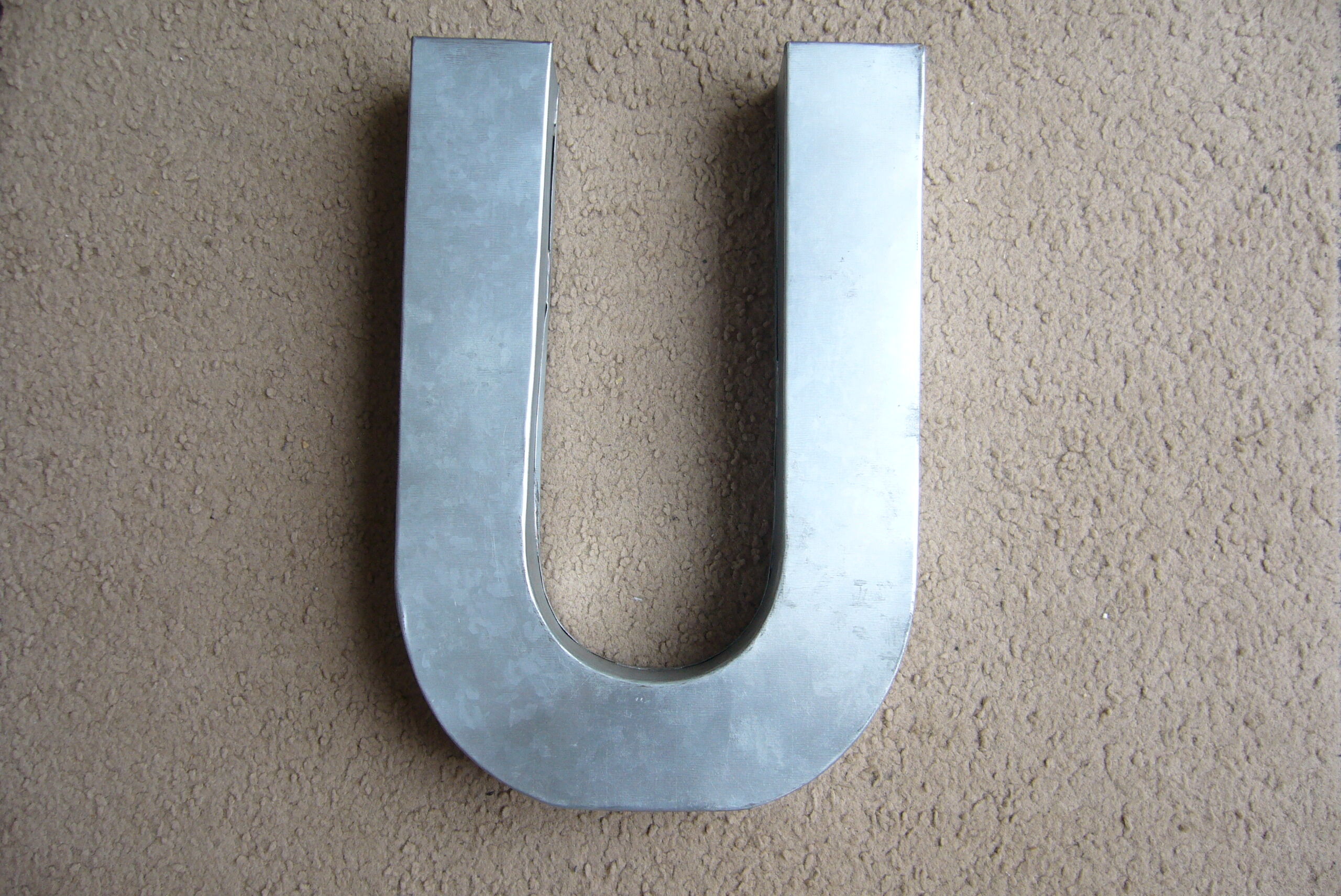 Letter U industrial white metal