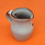 Glazed ceramic pitcher floral decoration