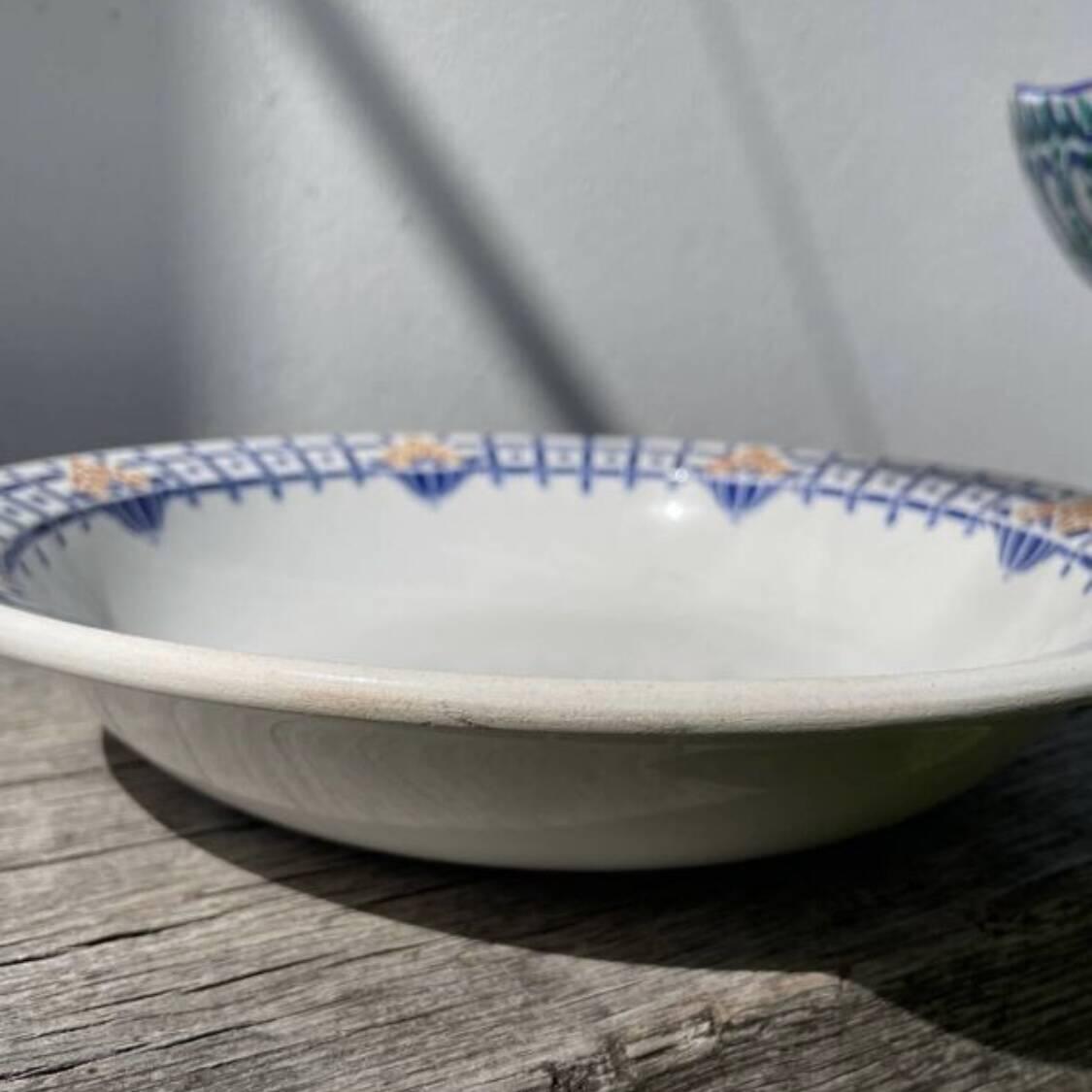 Round, shallow ceramic salad bowl from Saint Amand