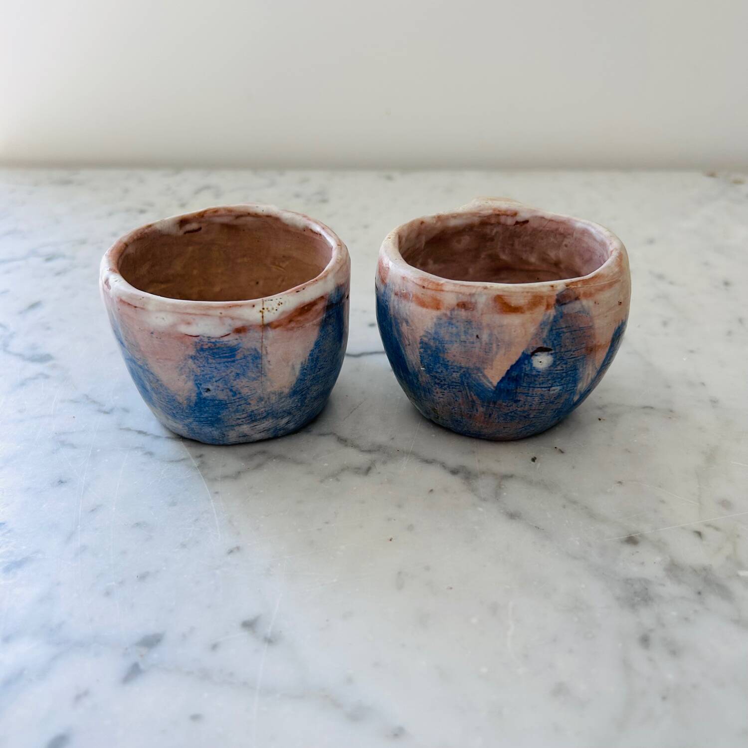 Set of artisanal pitcher and weathered cups