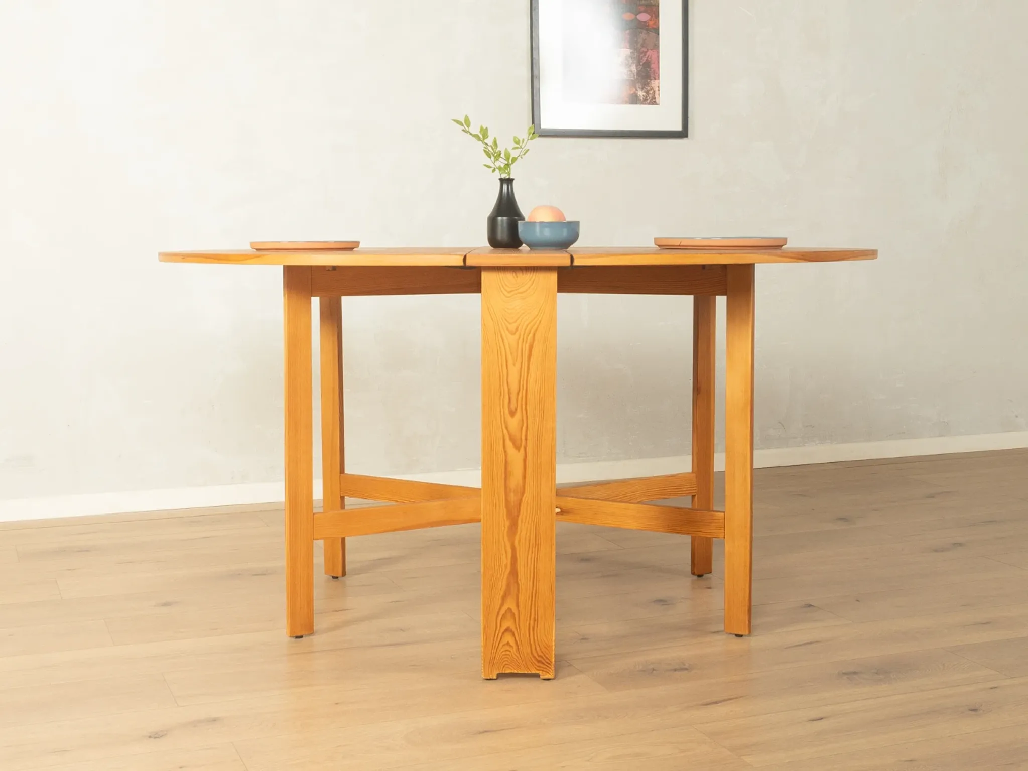 Practical folding table from the 1980s made of light brown pine wood