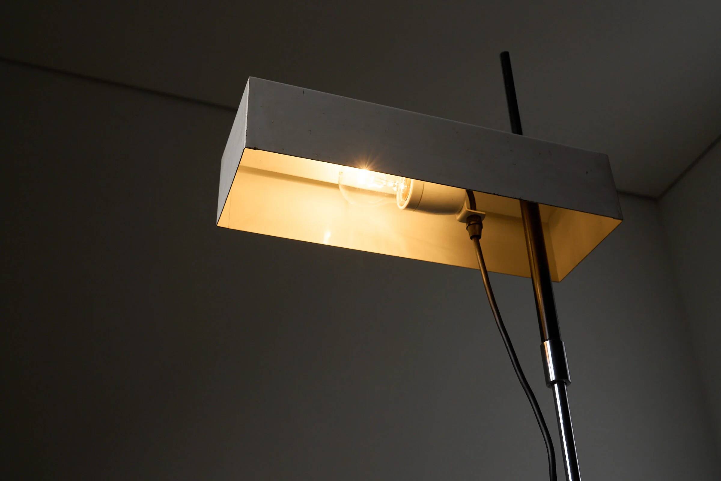 Adjustable perforated shade floor lamp