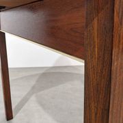 Extendable round rosewood dining table