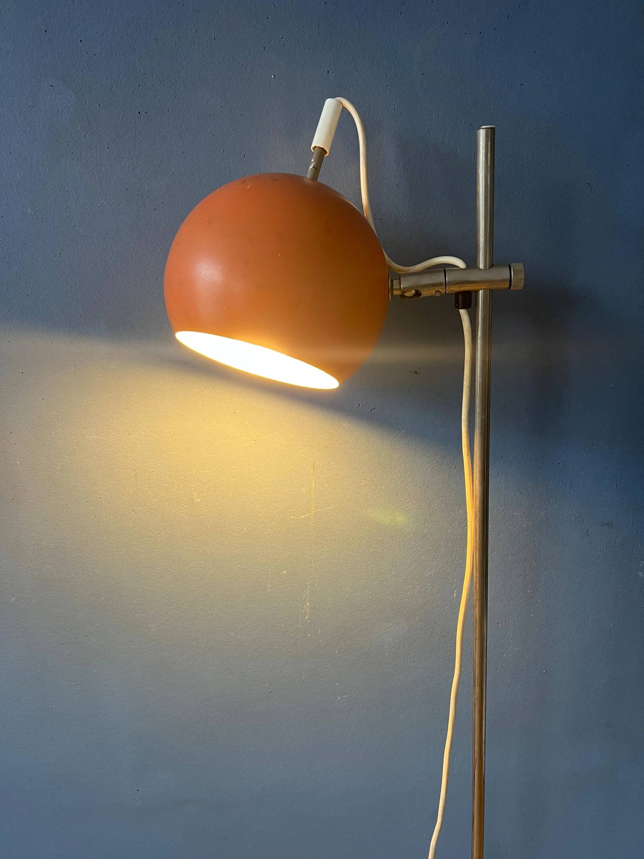 Mid-Century orange floor lamp with "eyeball" shade