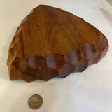 Carved wooden pocket emptier
