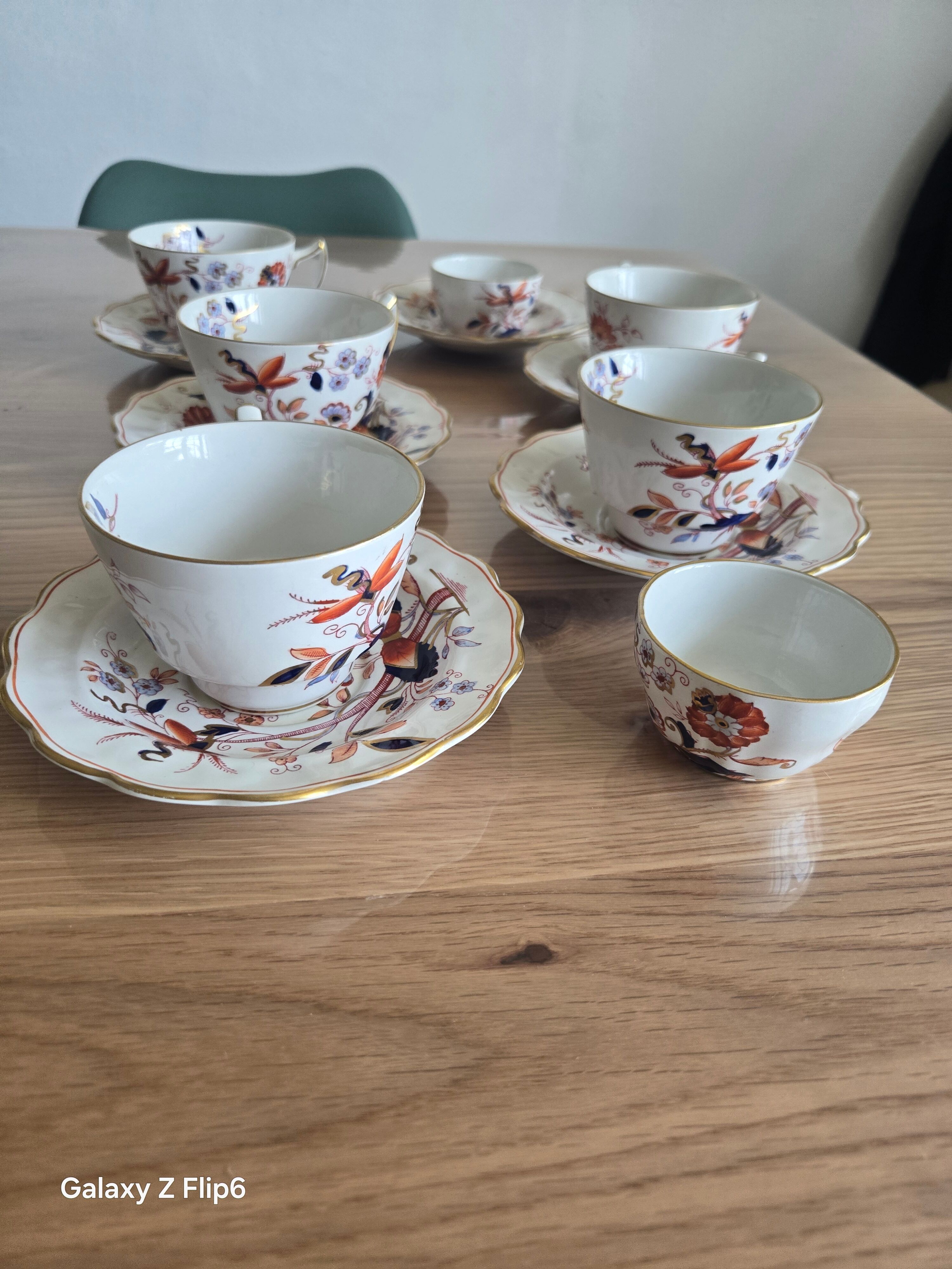 5 tea cups with saucers and 2 small pots, made in England.