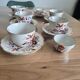 5 tea cups with saucers and 2 small pots, made in England.
