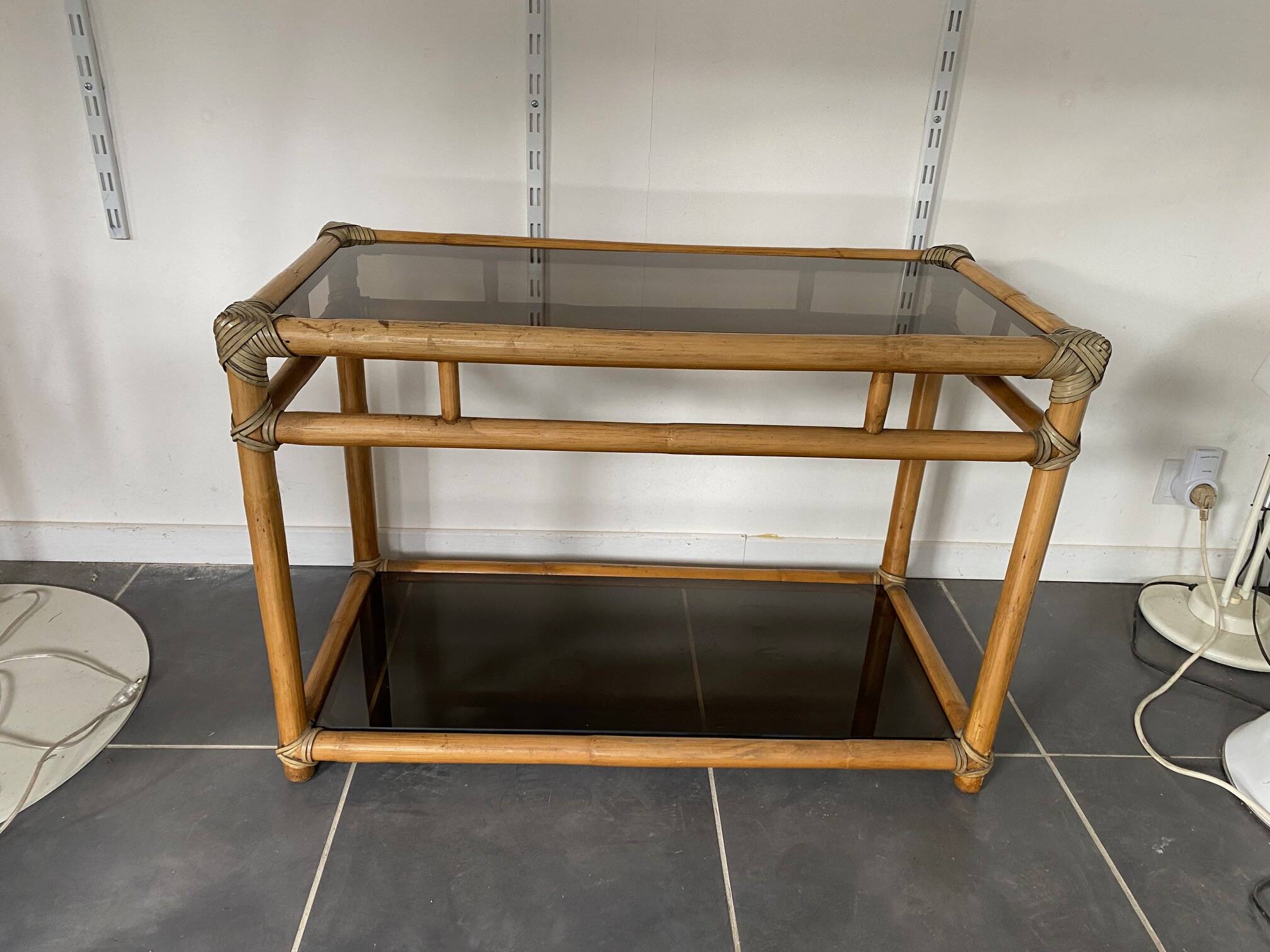 Vintage 1950s rattan and glass TV storage unit.
