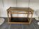 Vintage 1950s rattan and glass TV storage unit.