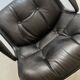 Black leather office chair and armrest by Charles Pollock for Knoll International