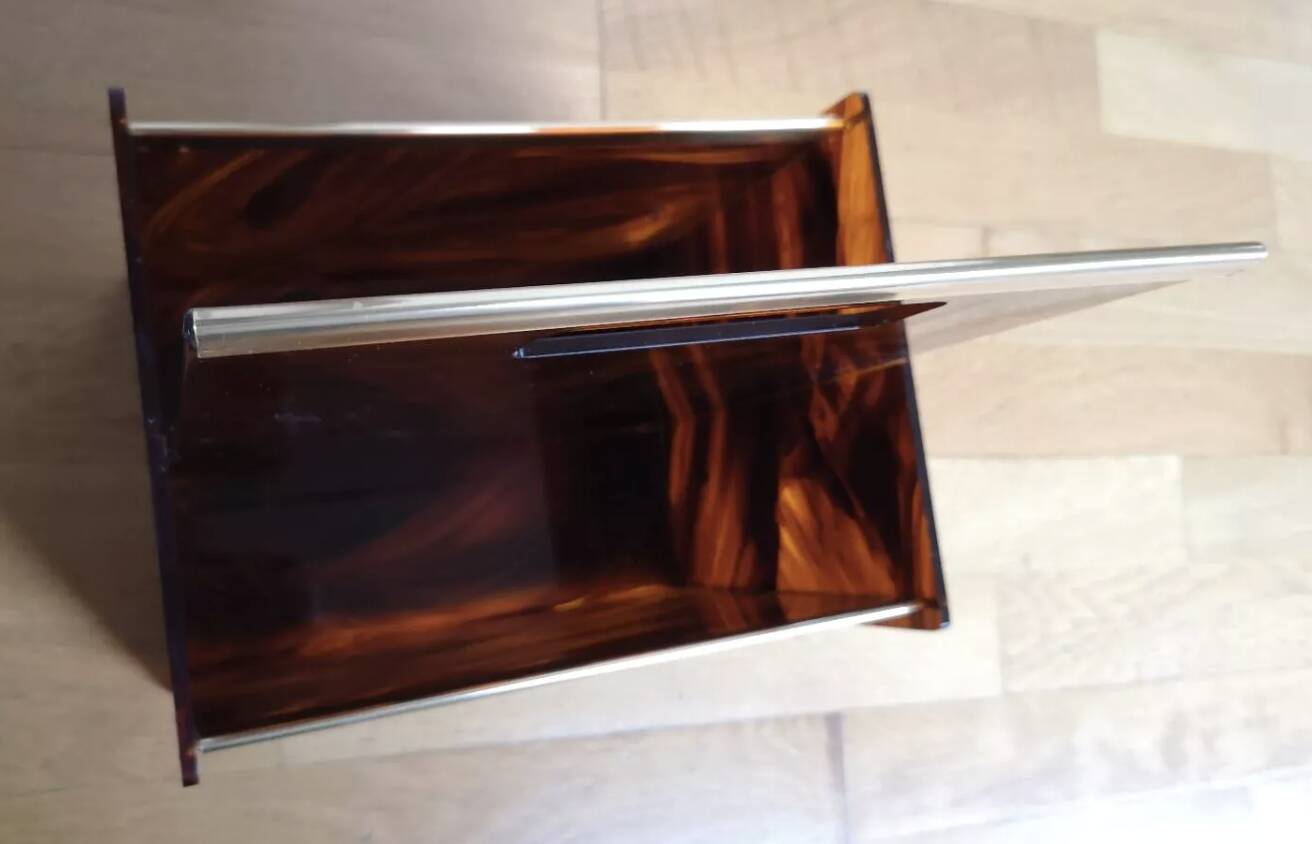 Tortoiseshell lucite magazine rack from the Christian Dior Home collection.