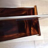 Tortoiseshell lucite magazine rack from the Christian Dior Home collection.