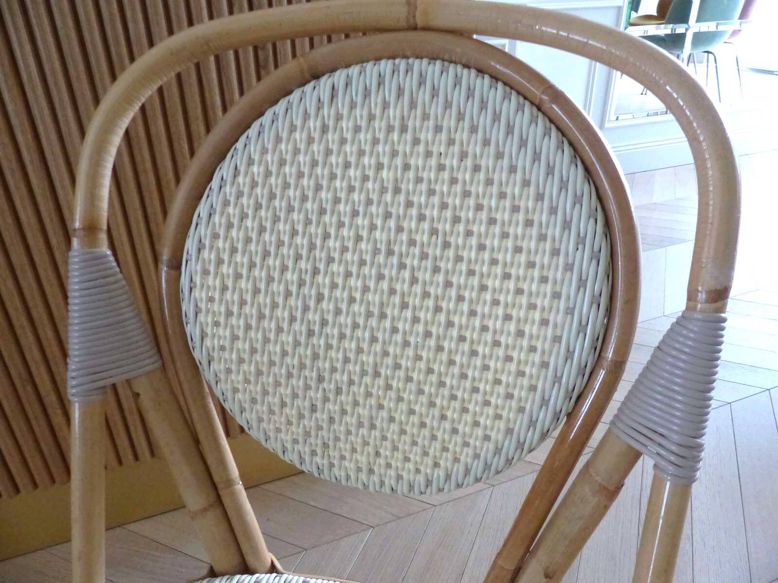 Pair of Parisian bistro chairs from Maison Louis Drucker in light Manila rattan.