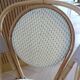 Pair of Parisian bistro chairs from Maison Louis Drucker in light Manila rattan.