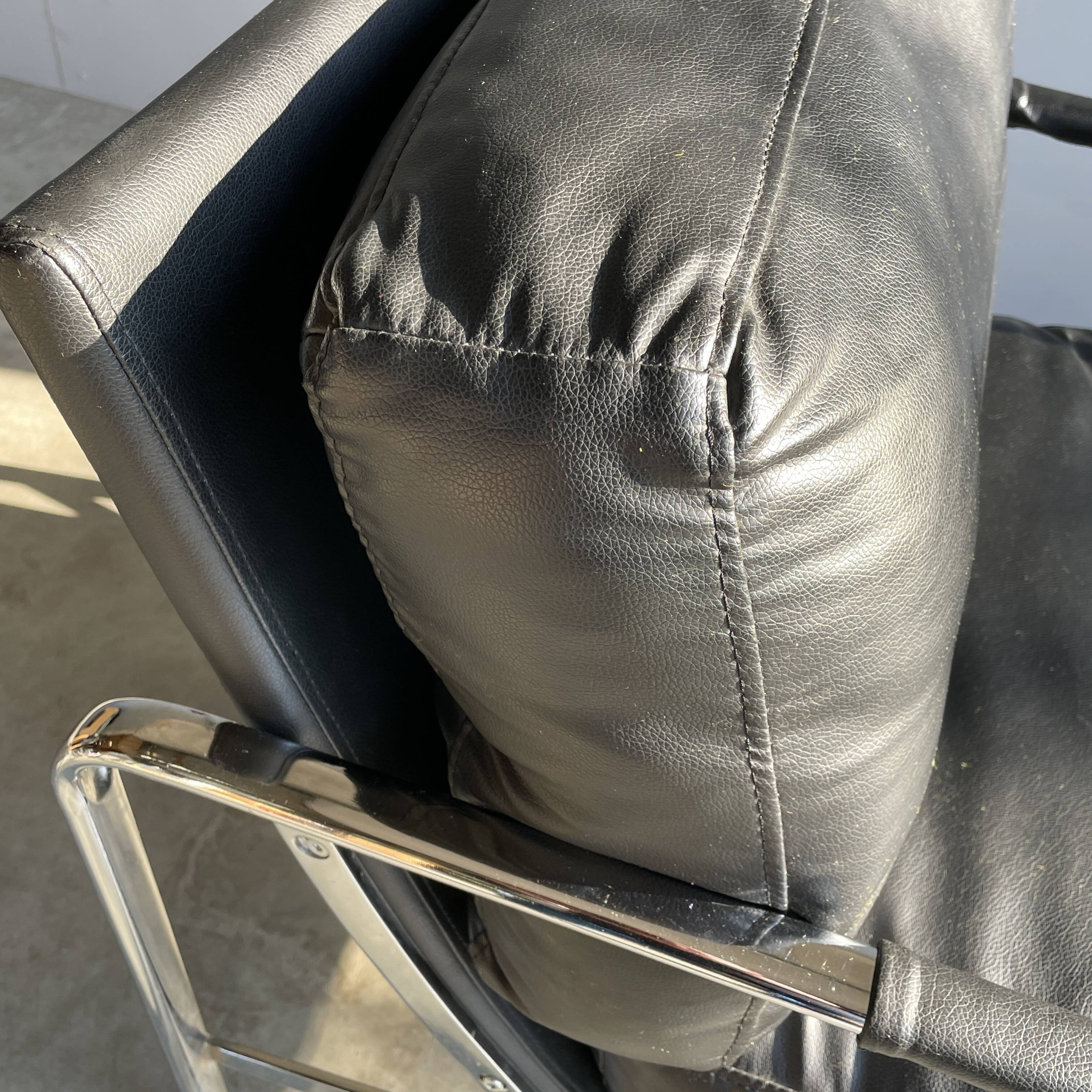 Vintage black leather armchair on metal base, 1980s