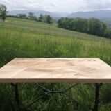 Inlaid bistro table with cases of wine.