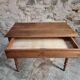 Antique French writing table in walnut with a drawer, circa 1900.