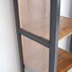 Pair of black wooden display cabinets with glass doors.