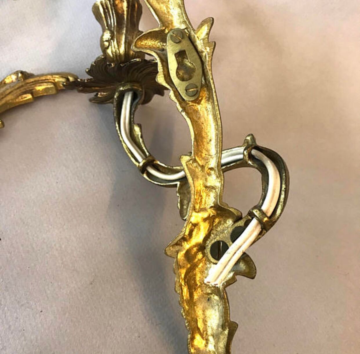 A pair of rococo gilded wall lights