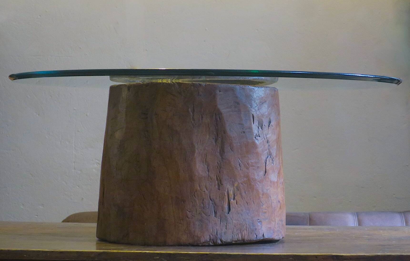 Carved antique tree stump coffee table with circular glass top
