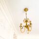 Small vintage brass chandelier with amber crystal pendants.