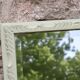Large antique bevelled mirror in carved solid wood, green lizard – 129 × 75