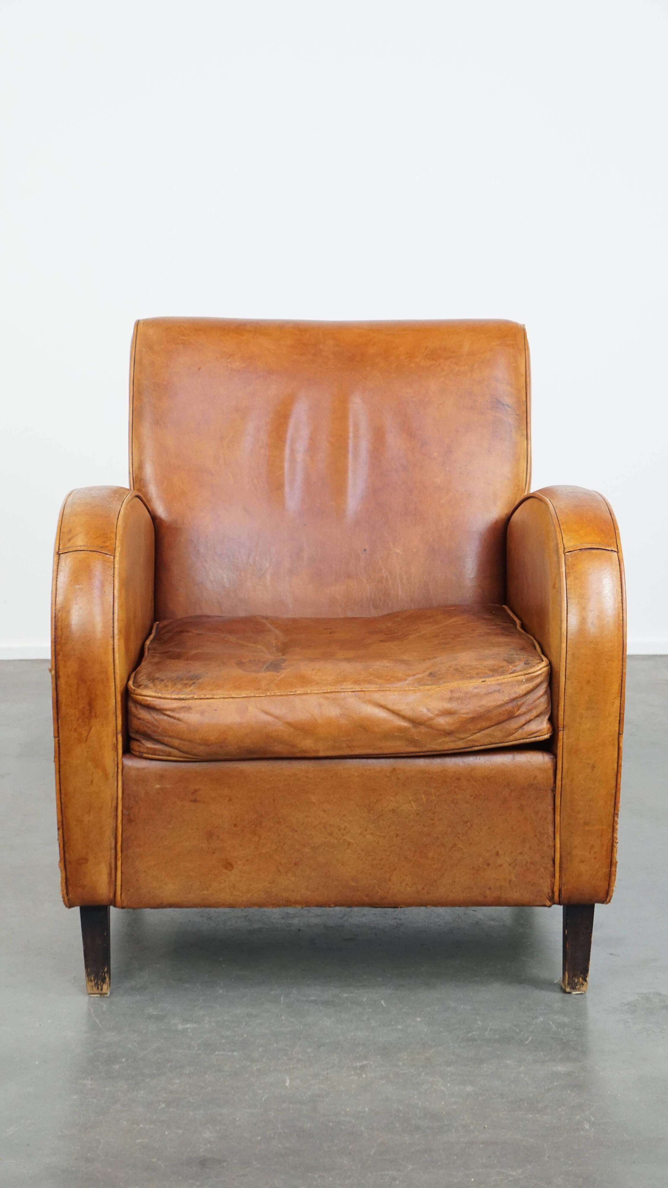 Characteristic sheepskin design armchair in beautiful warm cognac colours