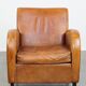 Characteristic sheepskin design armchair in beautiful warm cognac colours