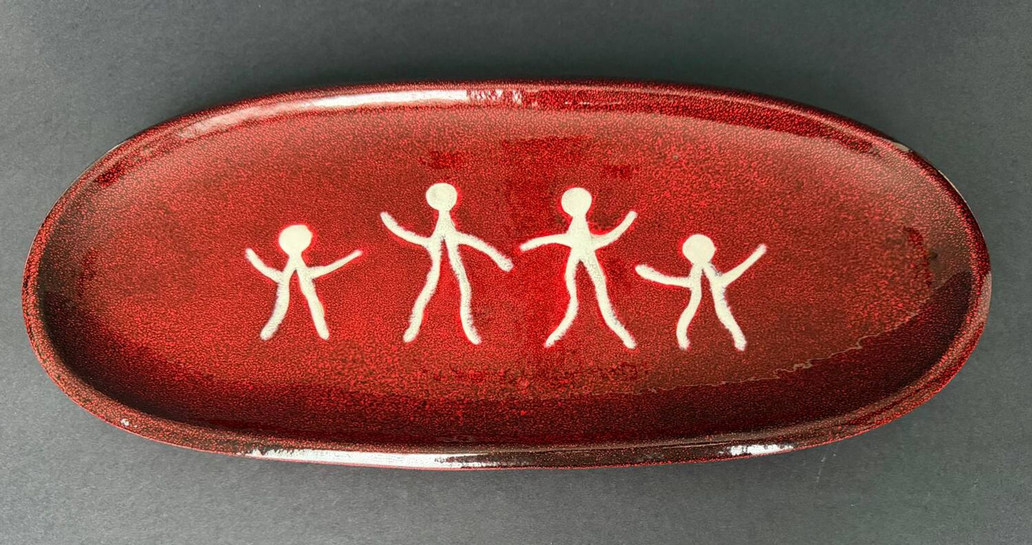 Large red ceramic dish