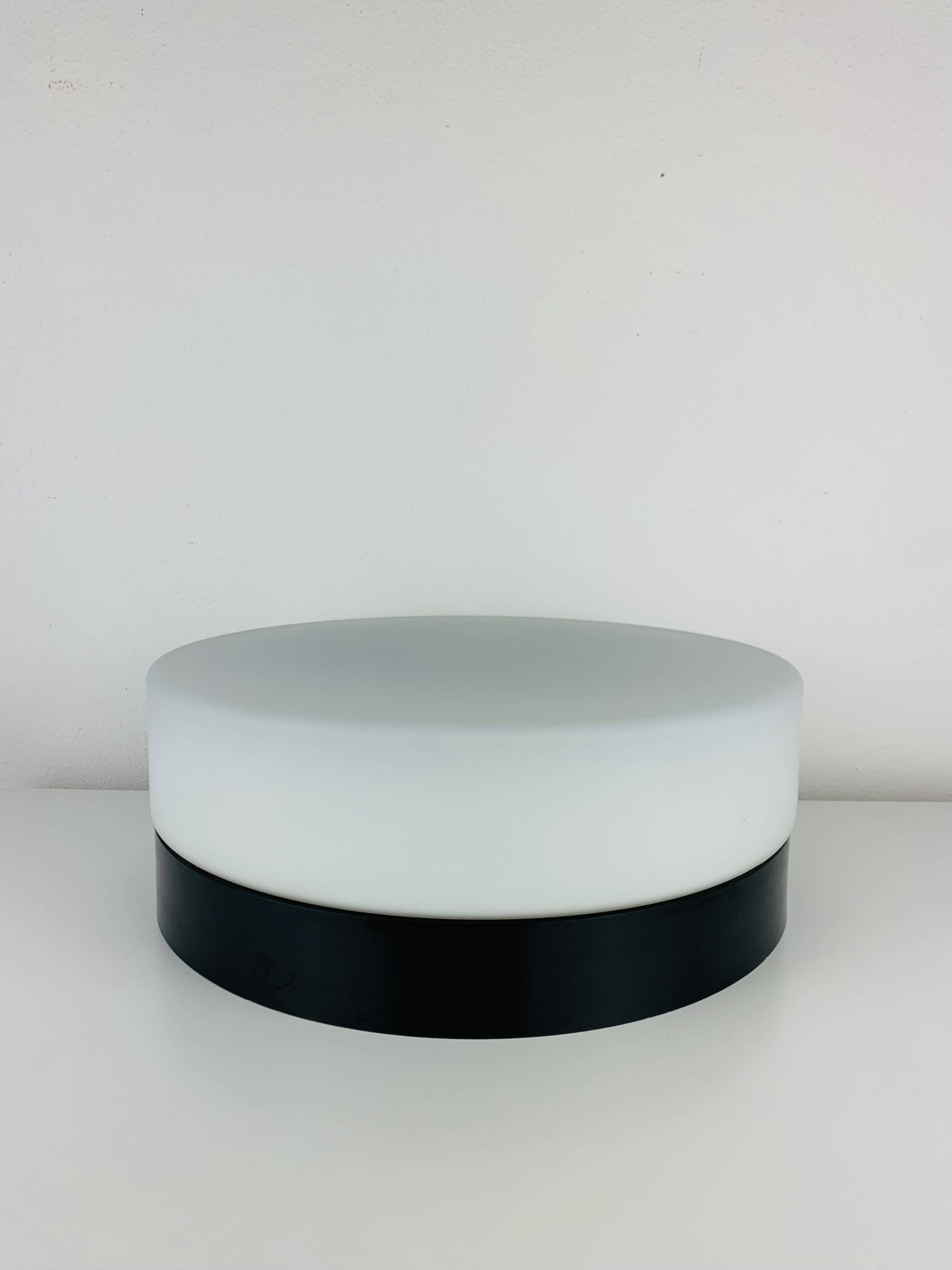 Erco round opaline wall light from the 1960s