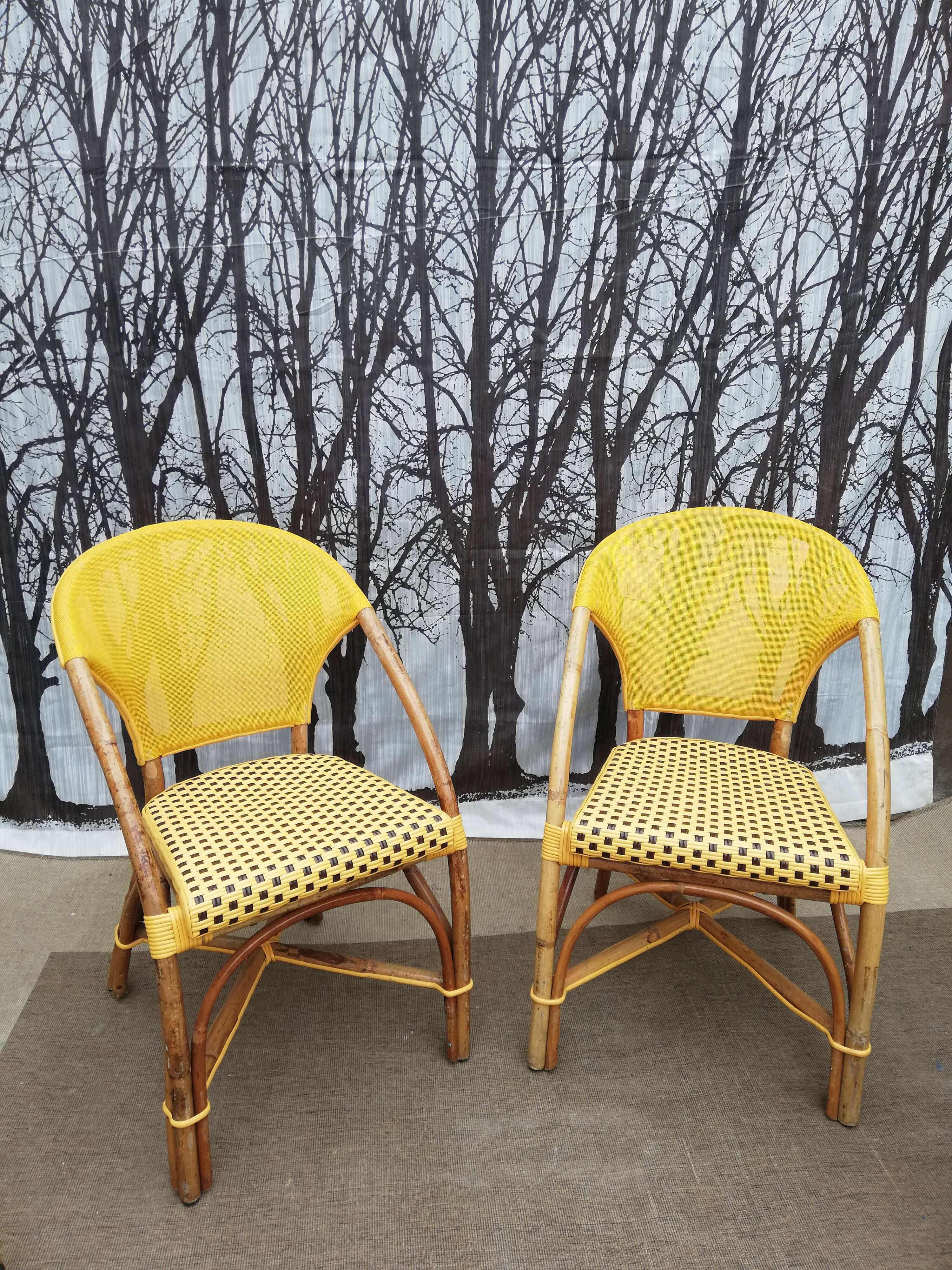 Two rattan bar armchairs
