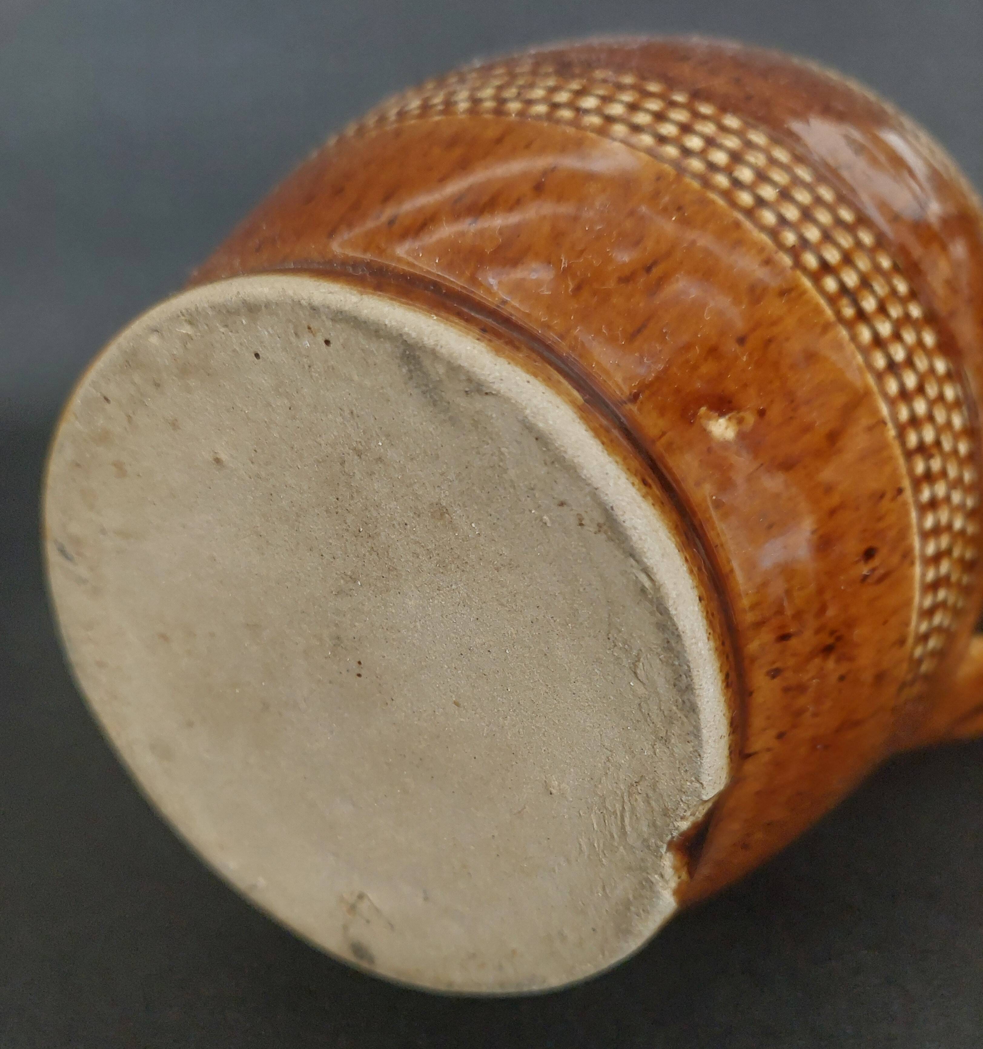 Mid-20th century brown glazed stoneware wine pitcher