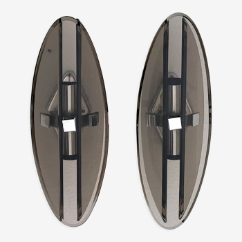 Pair of elliptical italian wall lamps in smoked glass and chrome veca