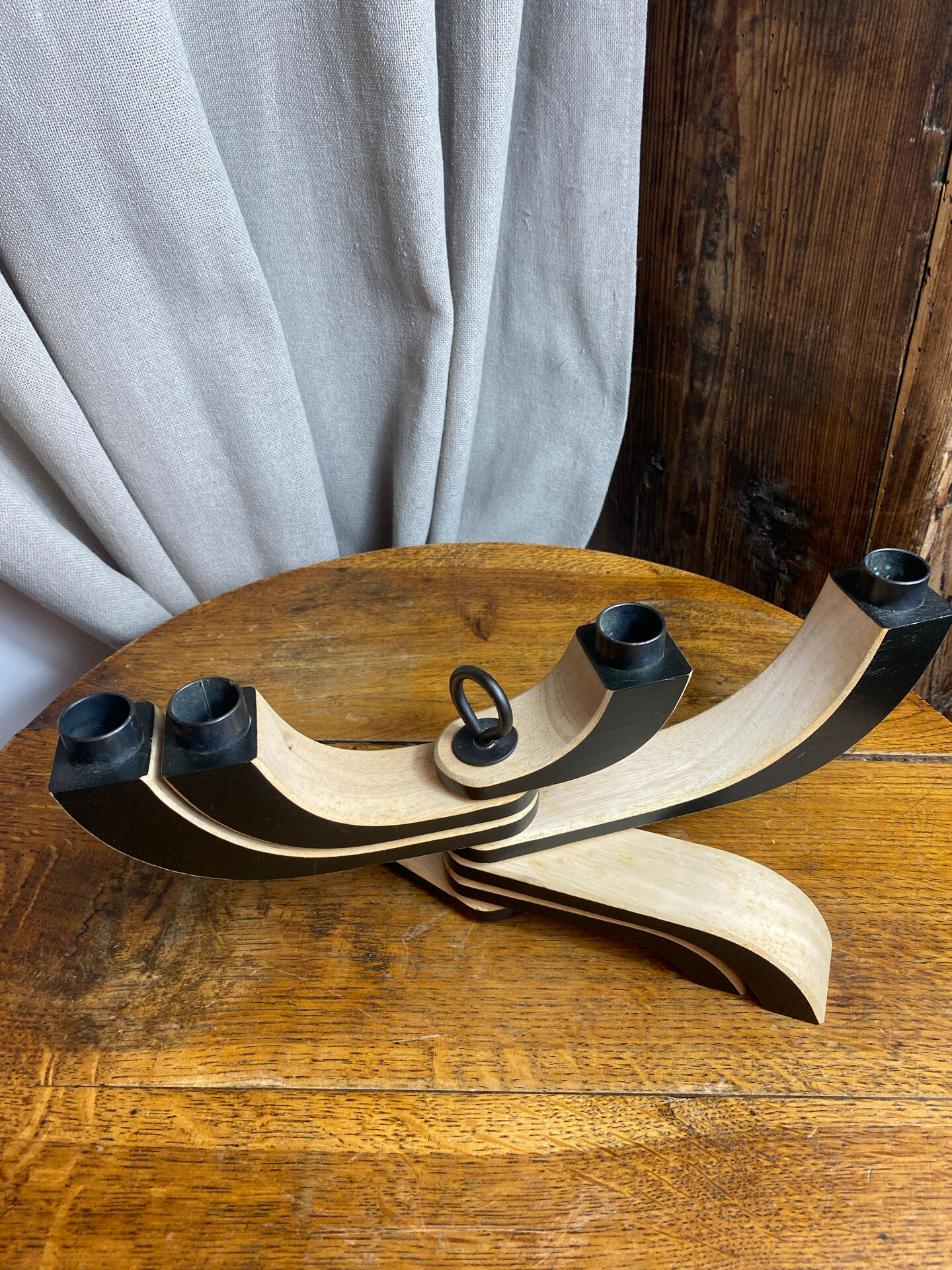 Foldable and deconstructed chandelier, minimalist Swedish design in wood.