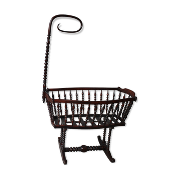 Old mahogany tinted exotic wooden cradle