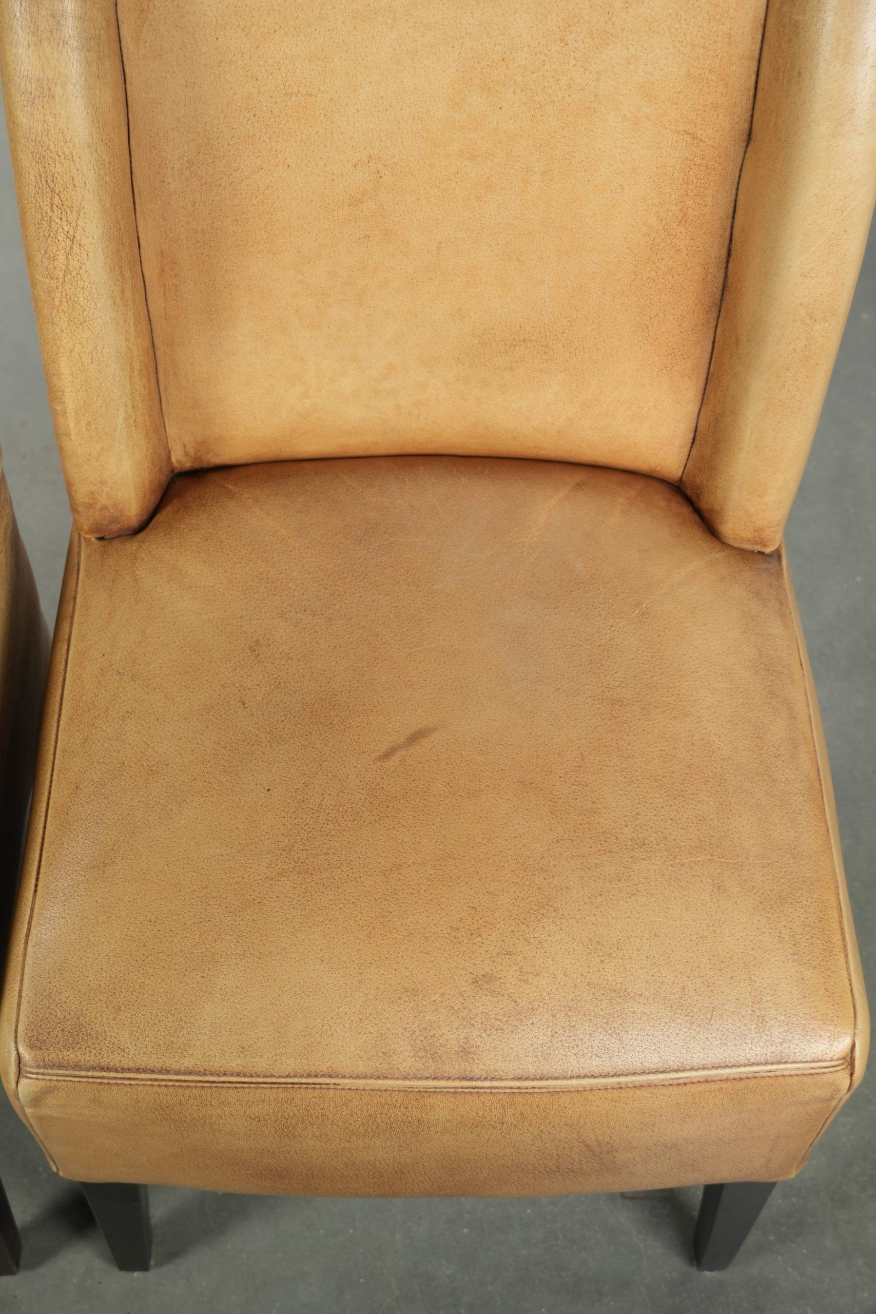 Set of six cowhide dining chairs with a comfortable seat and high back