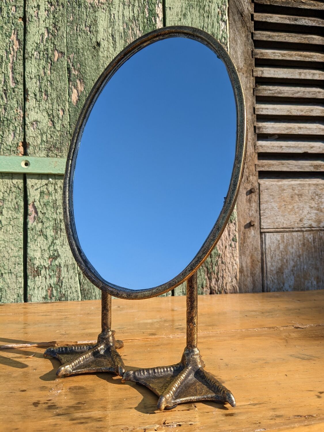 Metal mirror with duck legs