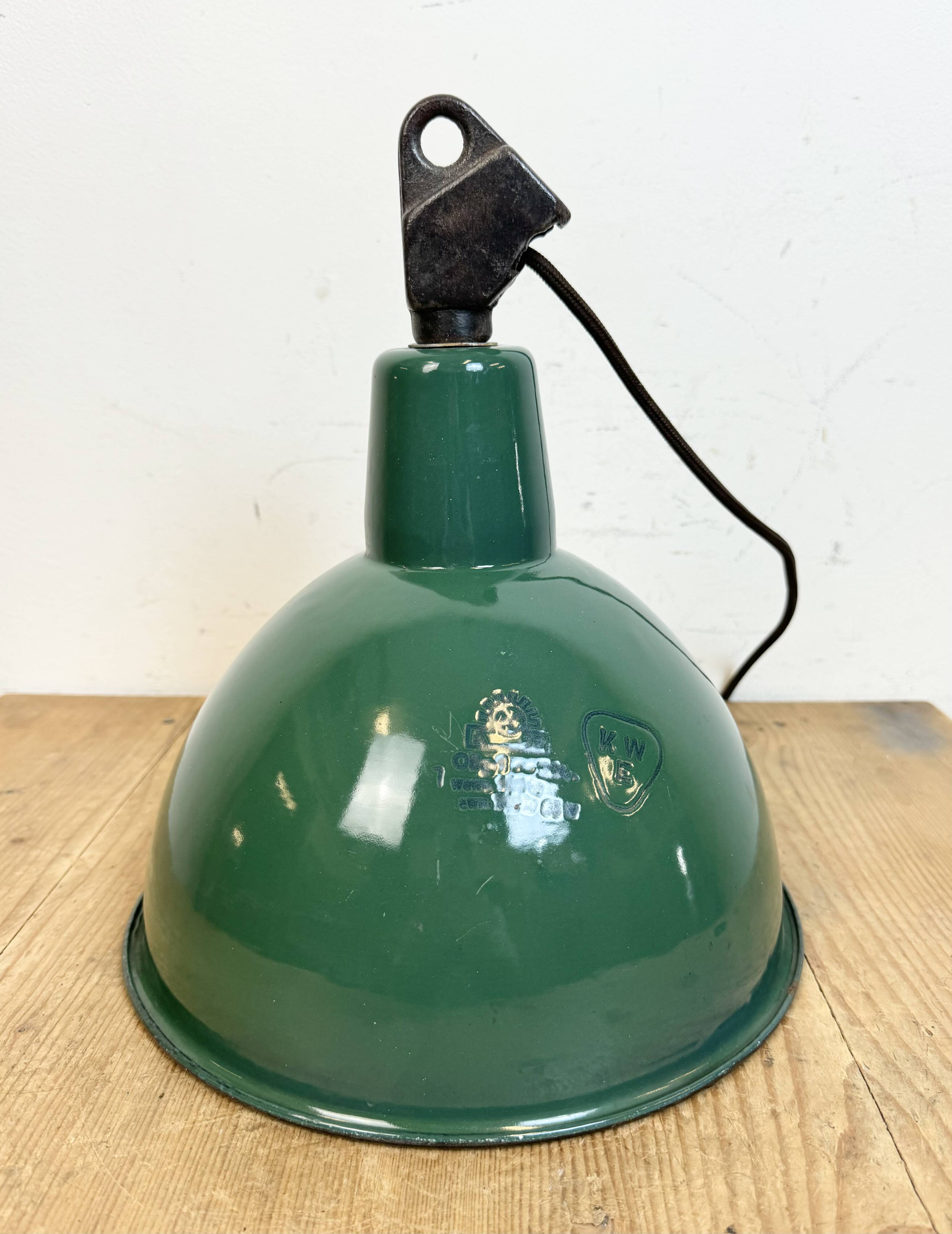 Industrial green enamel factory lamp with cast iron top, 1960s