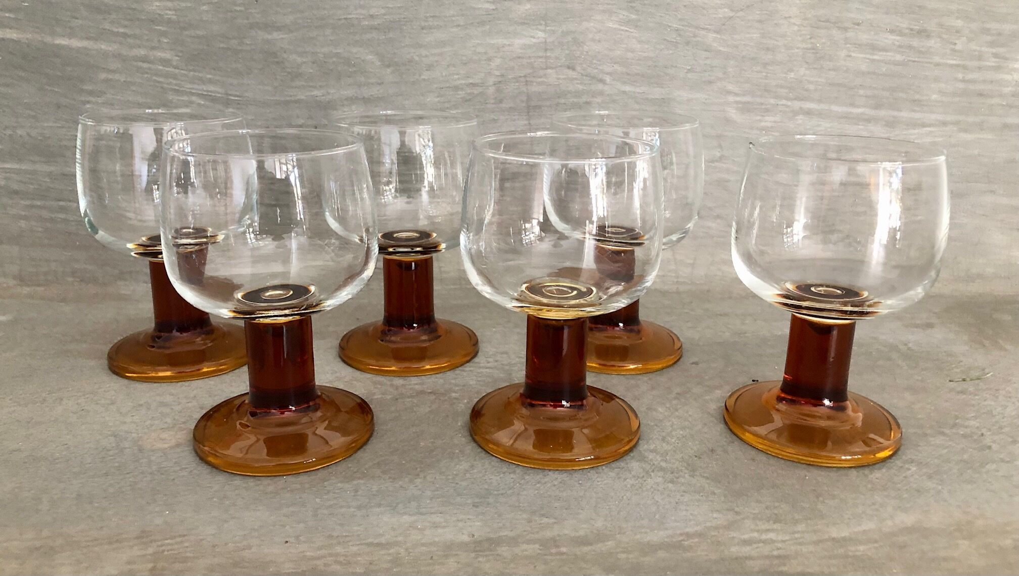 6 Amber stemmed glasses an'70