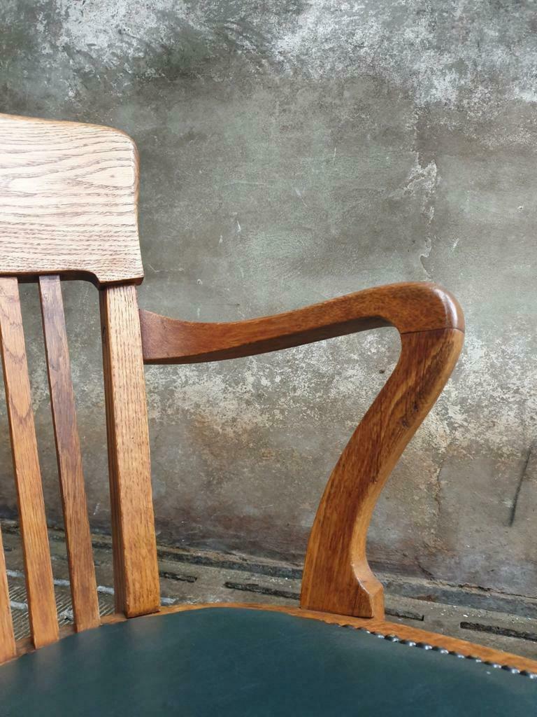 Antique office chair oak adjustable with green leather