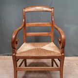 Rustic straw armchair with butts