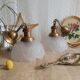 Pair of frosted glass flower pendant lights with vintage wood and brass