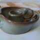 Pair of cellar rat candle holders in glazed sandstone