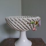 Cup on woven ceramic base with slip flowers